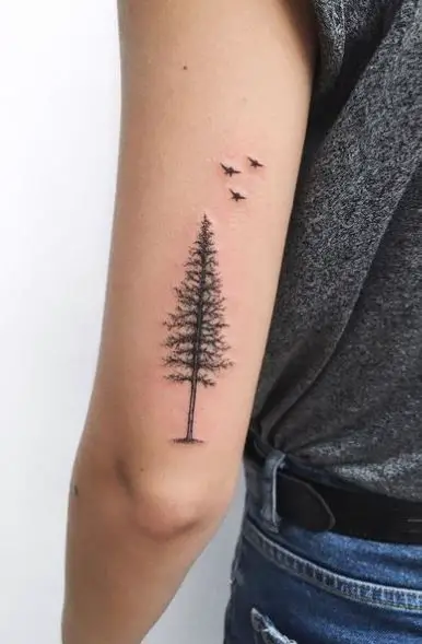 Flying Birds and Pine Tree Arm Tattoo