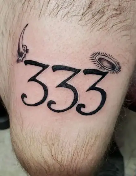 Black Horn and 333 Thigh Tattoo