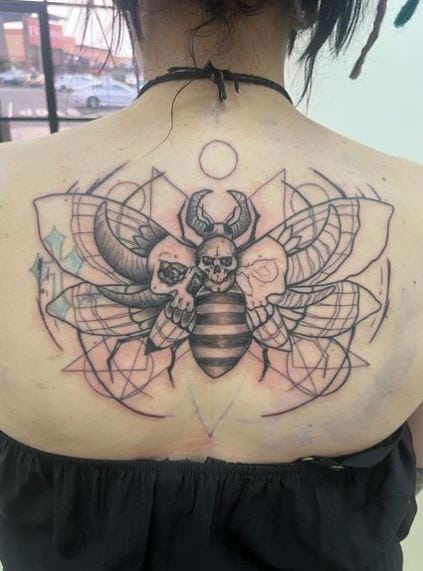 Symmetrical Skull and Death Moth Back Tattoo