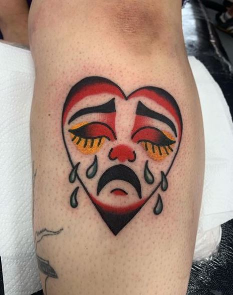 Colored Crying Heart with Closed Eyes Forearm Tattoo