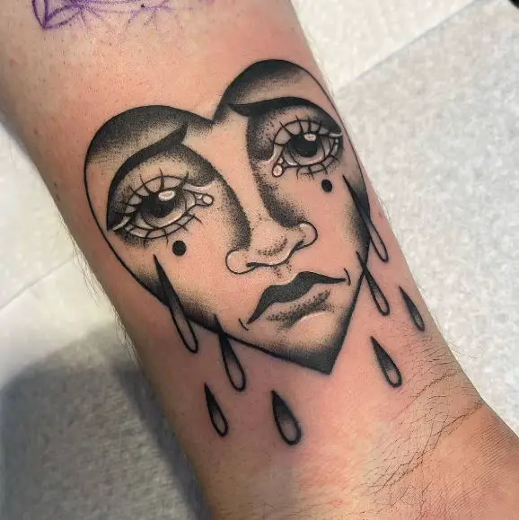 Black Shaded Crying Heart Forearm Tattoo