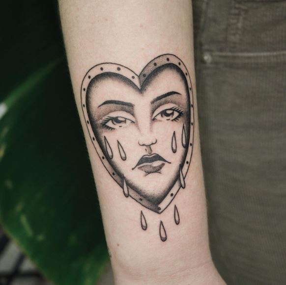 Grey Shaded Crying Heart Forearm Tattoo