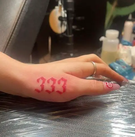 Red 333 Thumb Tattoo