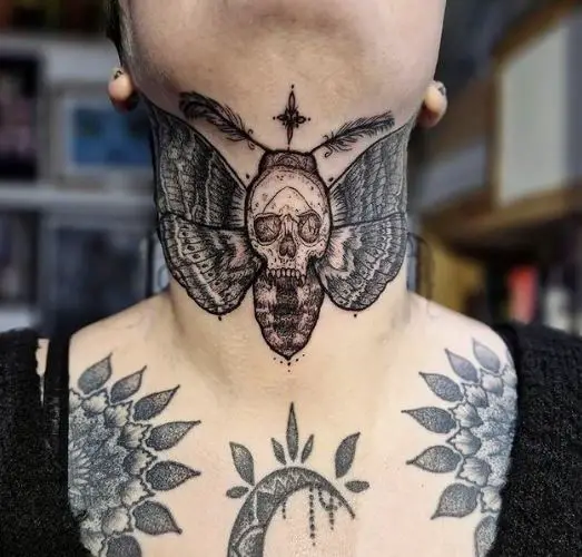 Butterfly skull neck tattoo feather