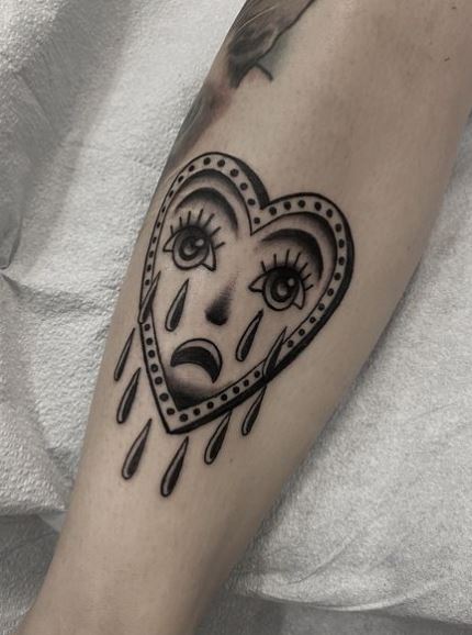 Black and Grey Crying Heart Leg Tattoo