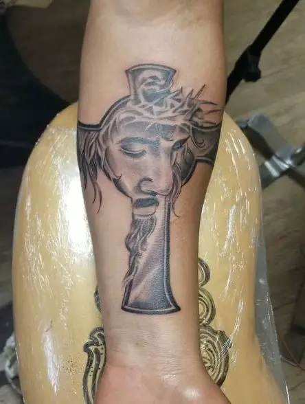Shaded Cross and Jesus Forearm Tattoo