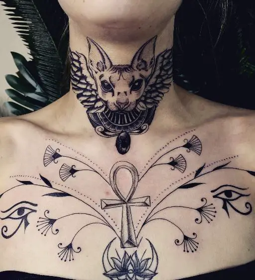 Flowers with Eyes of Ra and Ankh Chest Tattoo