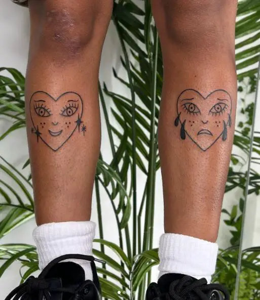 Smiling and Crying Heart Legs Tattoos