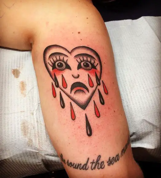 Crying Heart with Black and Red Tears Arm Tattoo