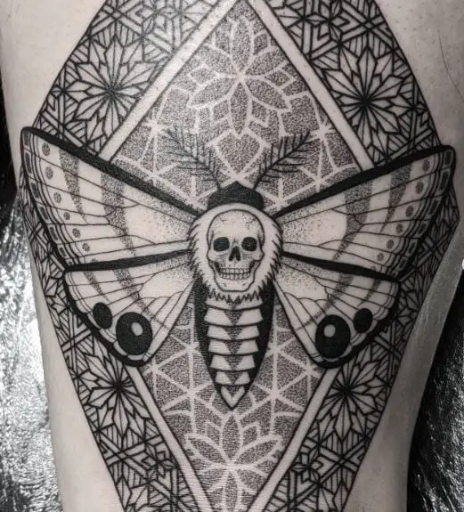 Ornamental Background and Death Moth Thigh Tattoo