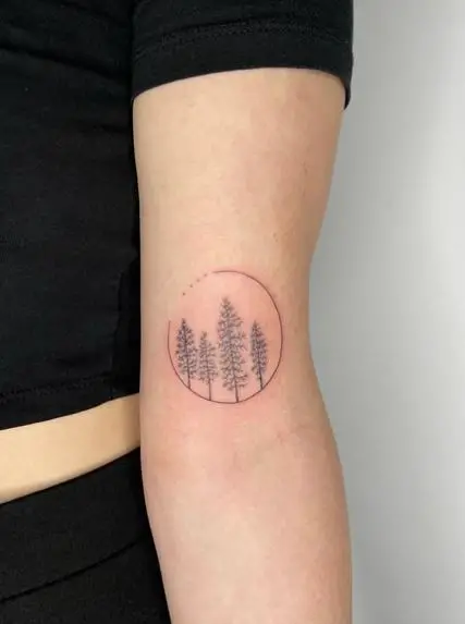 Grey Pine Trees Biceps Tattoo