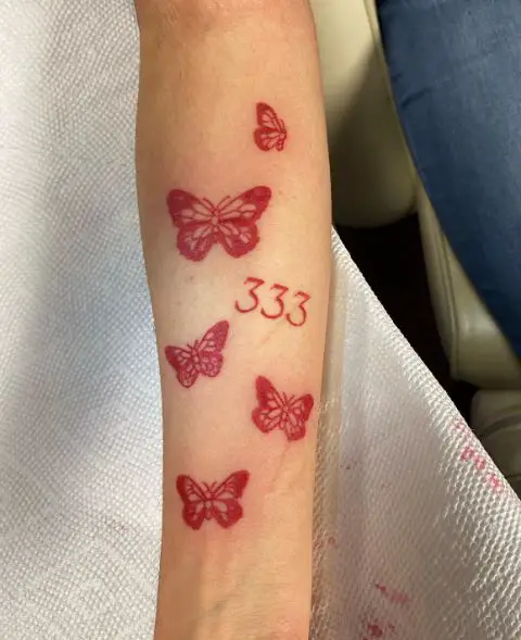 Red Butterflies and 333 Arm Tattoo