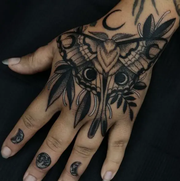 Black and White Death Moth Hand Tattoo