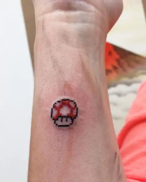 Minimalistic Super Mario Mushroom Forearm Tattoo