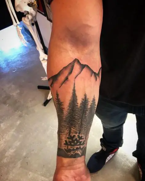 Mountain and Pine Forest Forearm Tattoo