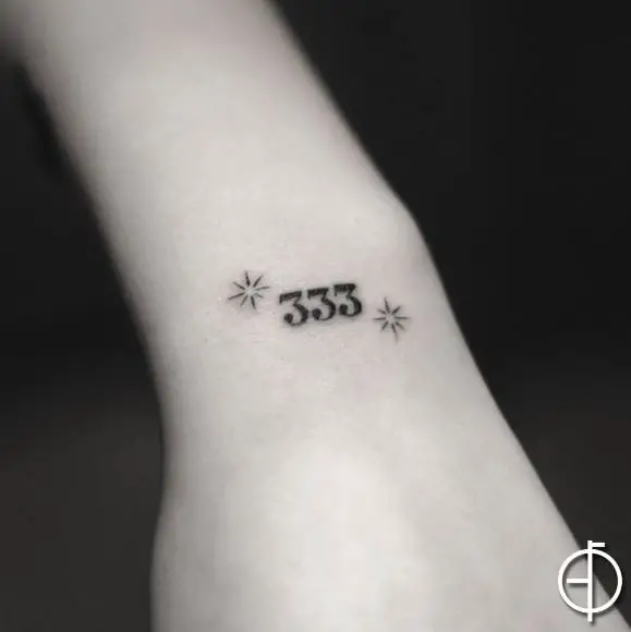 Black Stars and 333 Wrist Tattoo