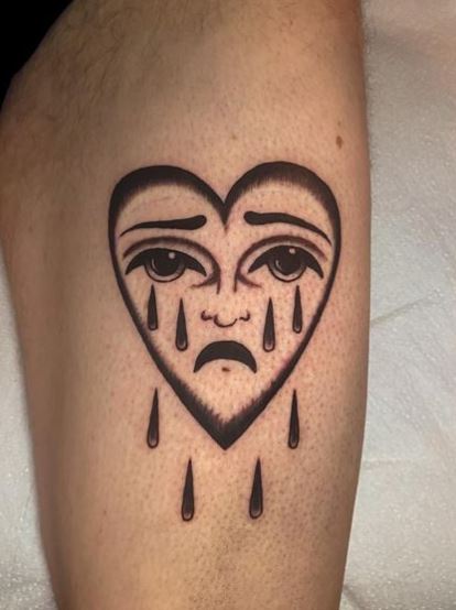 Black and Grey Crying Heart Thigh Tattoo