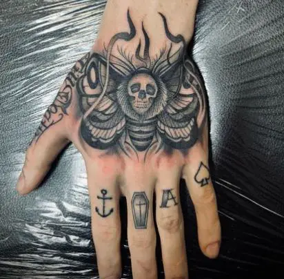 Black and Grey Death Moth Hand Tattoo