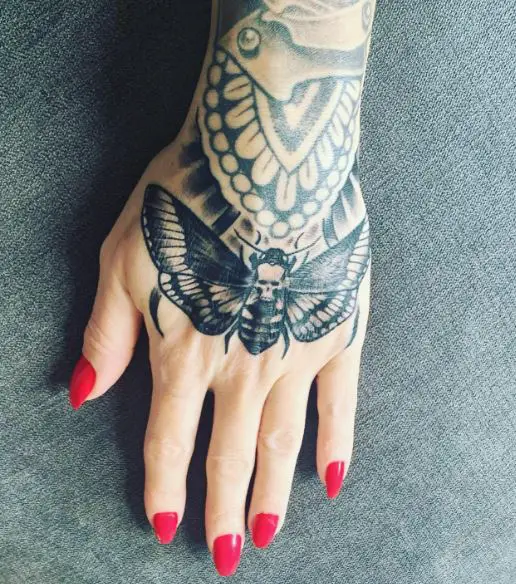 Black Death Moth Hand Tattoo