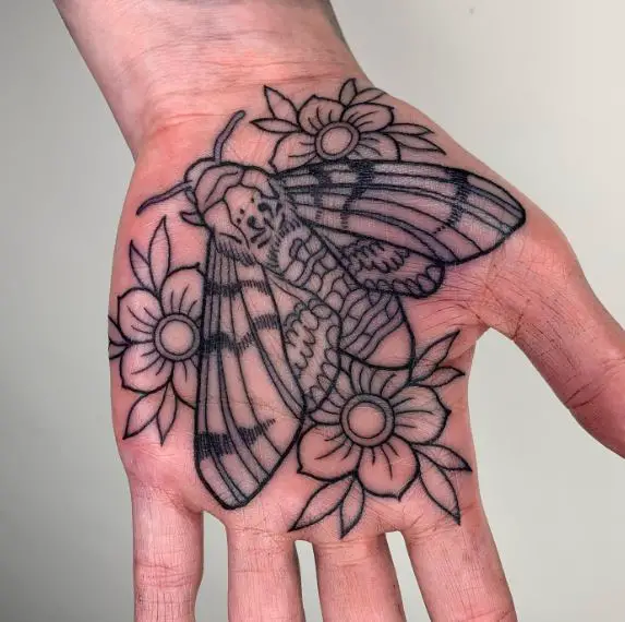 Flowers and Death Moth Palm Tattoo
