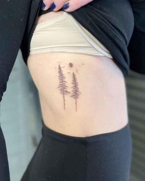 Grey Pine Trees Ribs Tattoo