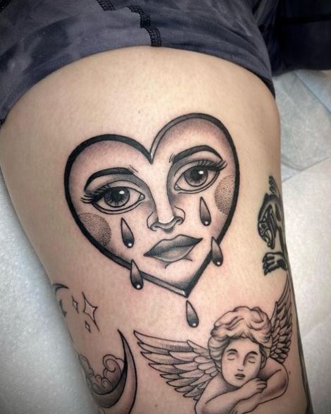 Angel and Crying Heart Thigh Tattoo