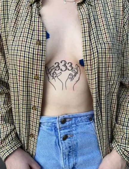 Hands and 333 Stomach Tattoo