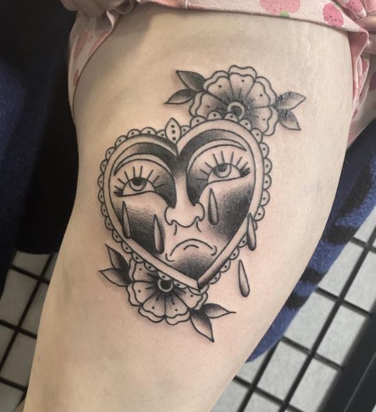 Flowers and Crying Heart Thigh Tattoo