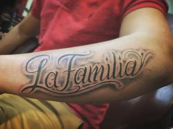 Honoring Family Script Forearm Tattoo