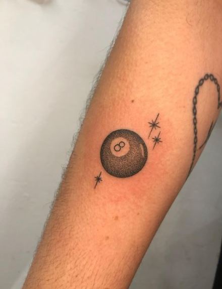 8 Ball Forearm Tattoo with Sparks