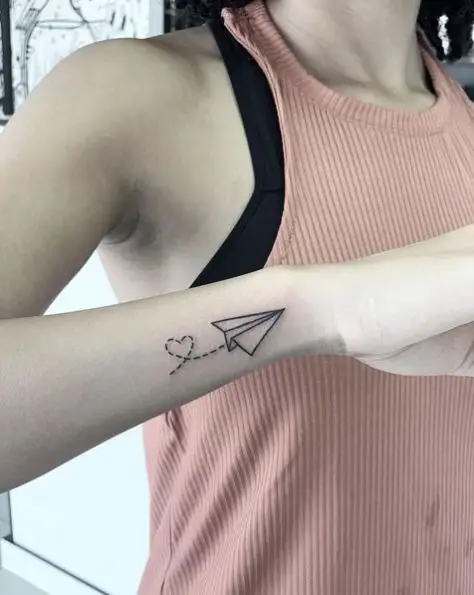 Black Line Paper Plane Tattoo with Heart Shaped Dotted Lines