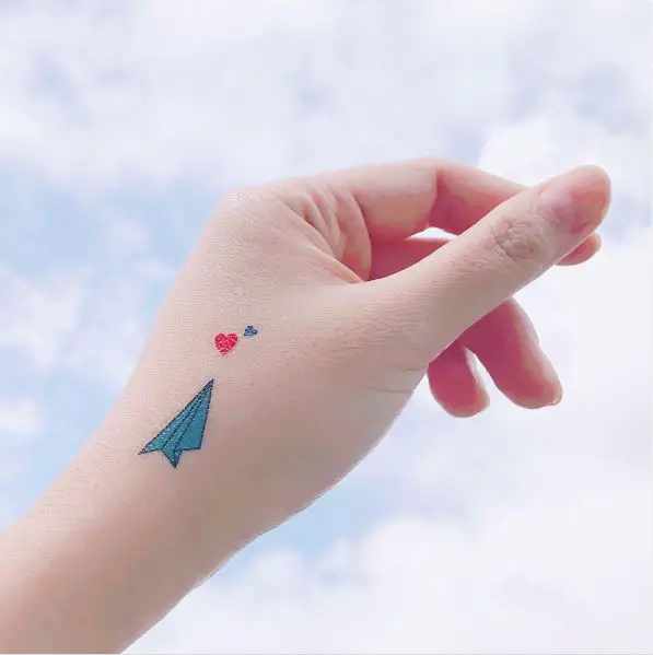Blue Paper Plane with Red and Blue Hearts Tattoo