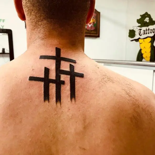 Bold Black Ink Three Cross Back Tattoo