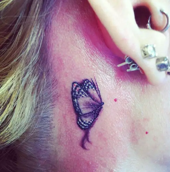 One Wing Shown Purple Butterfly Tattoo Behind Ear