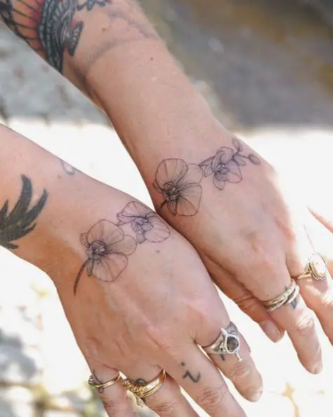 Connected Orchids Tattoo on Hands