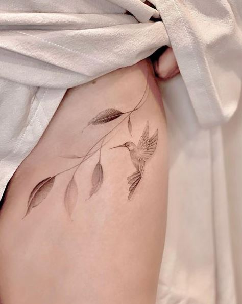 Faint Hummingbird and Leaf Tattoo