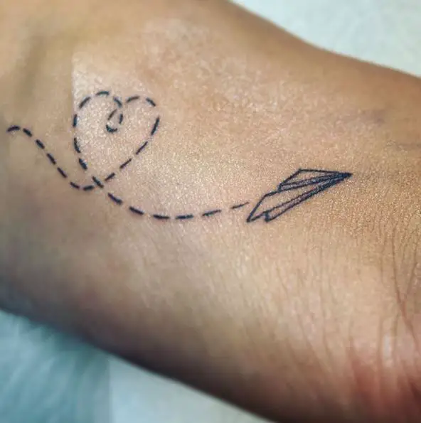Flying Paper Plane with Dotted Heart Shaped Lines Tattoo Piece