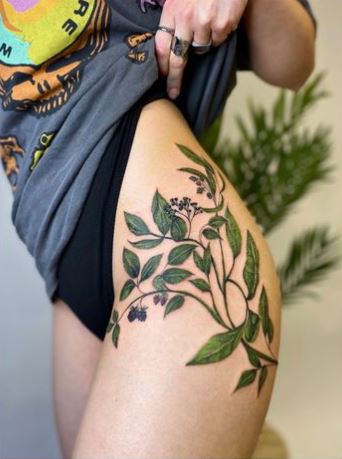 Green Colored Large Leaf Thigh Tattoo