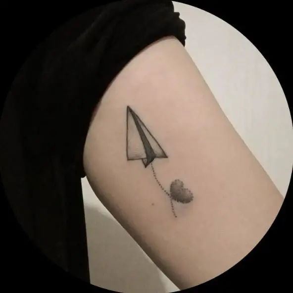 Greyish Paper Plane with Heart Arm Tattoo