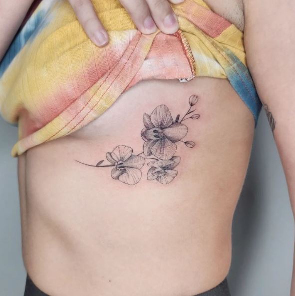 Greyscale Orchids Ribs Tattoo