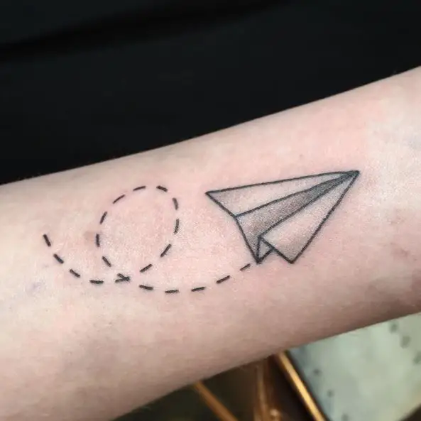 Greyscale Paper Plane Tattoo with Curvy Dotted Lines