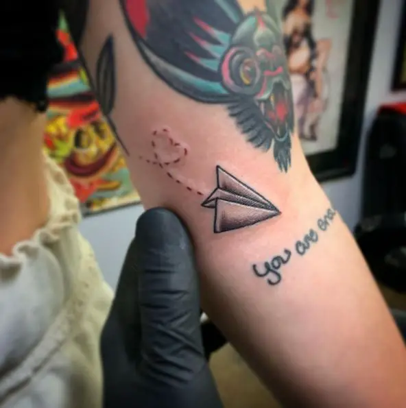 Greyscale Paper Plane with Heart Shaped Dotted Line Tattoo