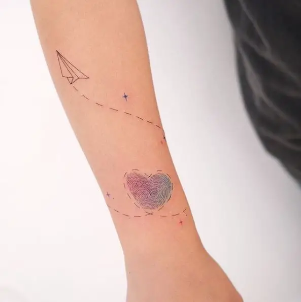 Heart Shaped Finger Print and Paper Plane Forearm Tattoo