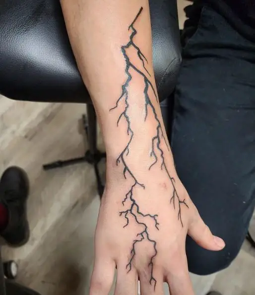 Lightning Bolt Streak Hand Tattoo