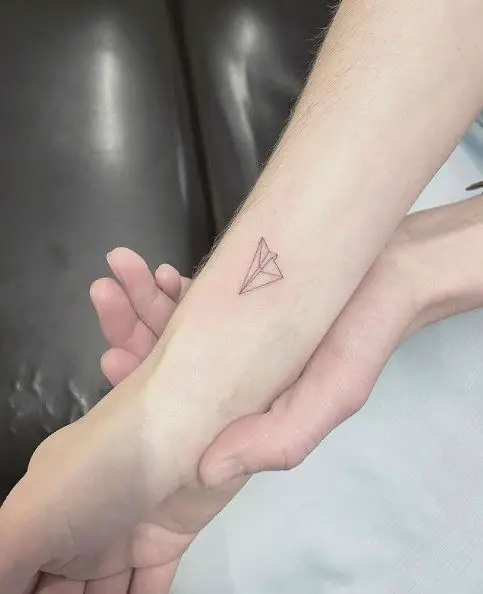 Mini Paper Plane Tattoo on the Wrist