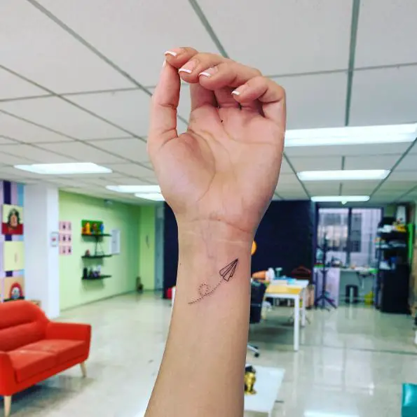 Minimalist Paper Plane Wrist Tattoo
