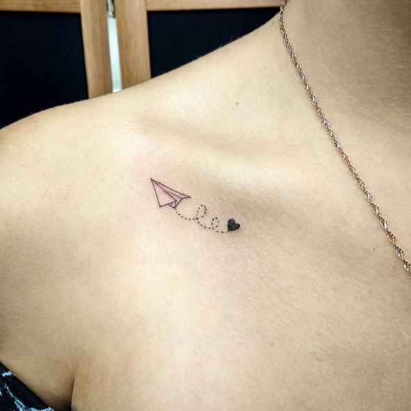 Paper Plane and Black Heart Collarbone Tattoo