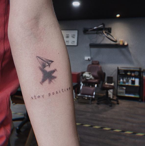 Paper Plane and Shadow Airplane Tattoo with a Quote