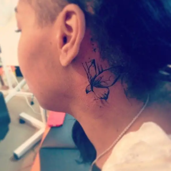 Simple Black Butterfly Tattoo Behind the Ear