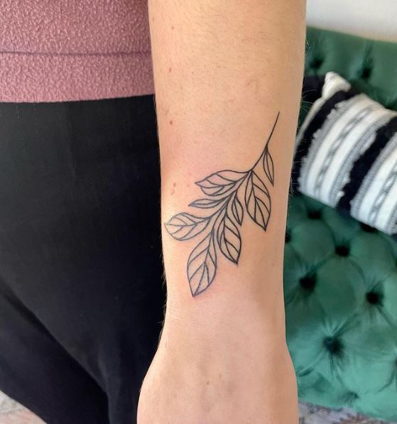 Simple Line Work Leaf Wrist Tattoo